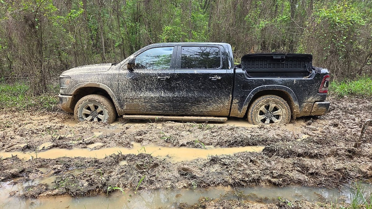 Steven Hughes' 2025 Ram Rebel side view of the truck stuck deep in the Georgia clay with its stock wheels &amp; tires