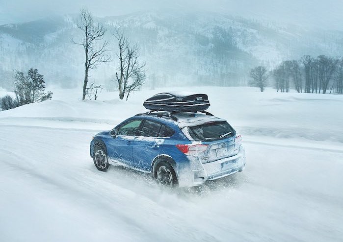 2024 Subaru Crosstrek driving in a snowstorm