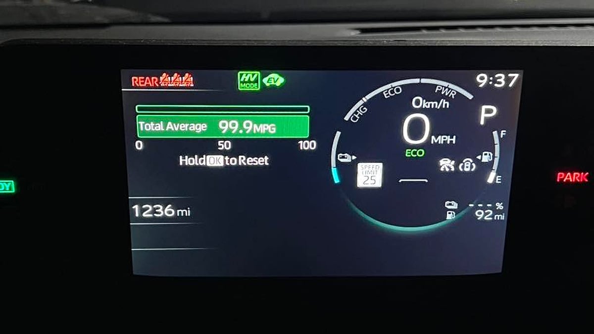 T.A. Geairn's 2026 Toyota Prius dash display showing the mileage and 99.9 mpg reading