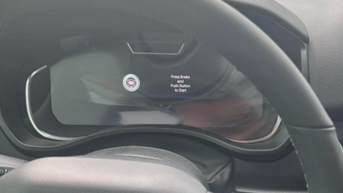 Interior dashboard view of Terrence's 2025 Ram 1500 showing a digital instrument cluster display with push-button start indicator and steering wheel controls in a modern vehicle.