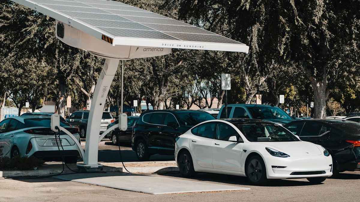 White Tesla Model 3 in Parking Lot charging