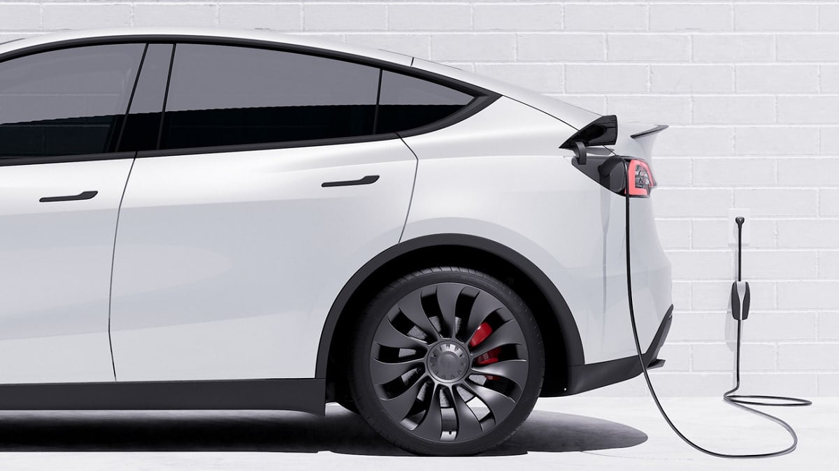 Tesla Model Y being charged by a mobile charger on 110 VAC