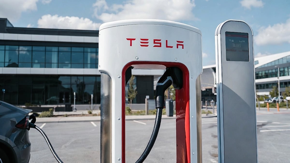 Tesla charing at a Supercharger at a shopping center