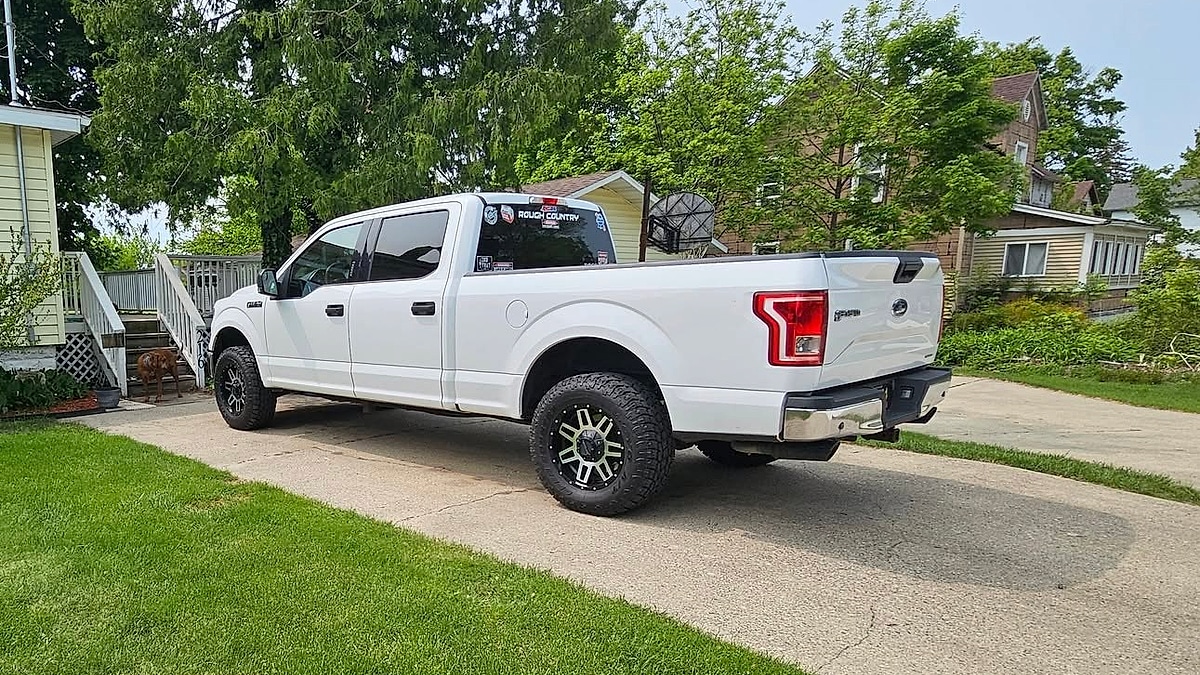 The rear view of Al Pipers Ford F-150 with 200,000 miles parked in his driveway
