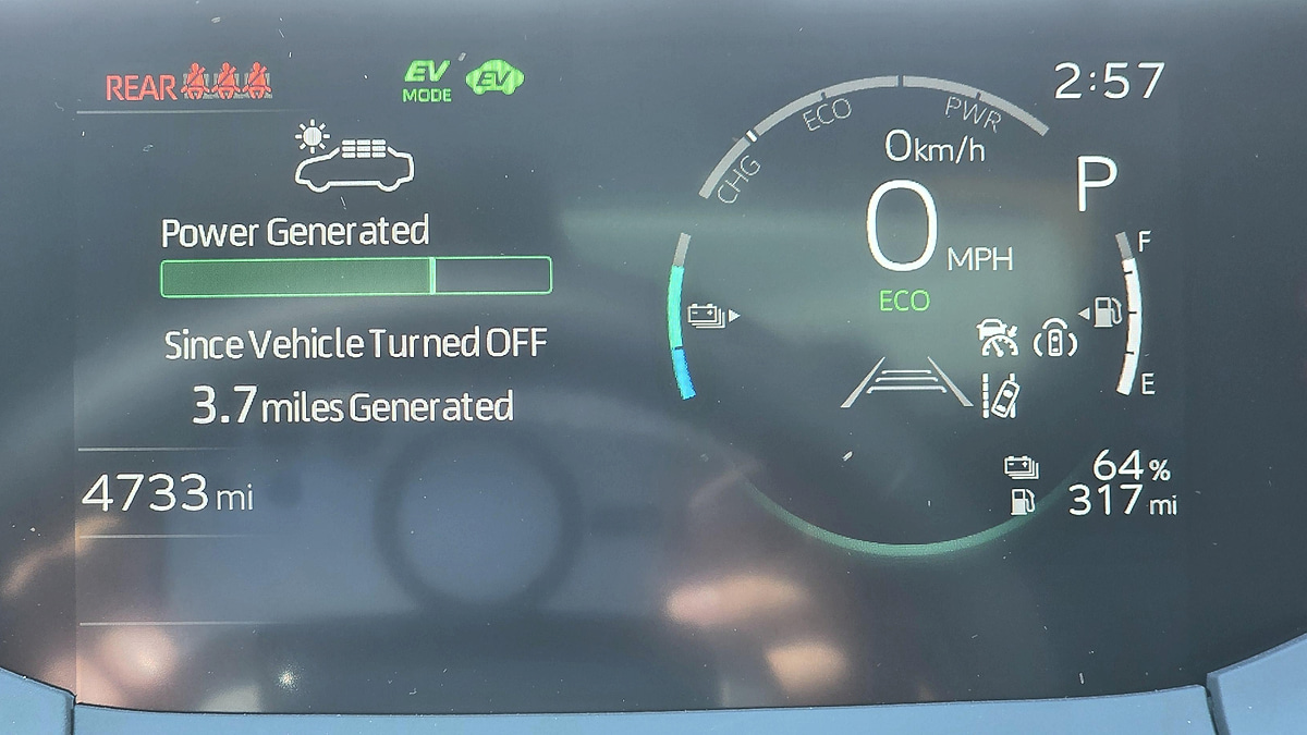 Toyota Prius dashboard showing regenerative braking energy generation and EV mode display