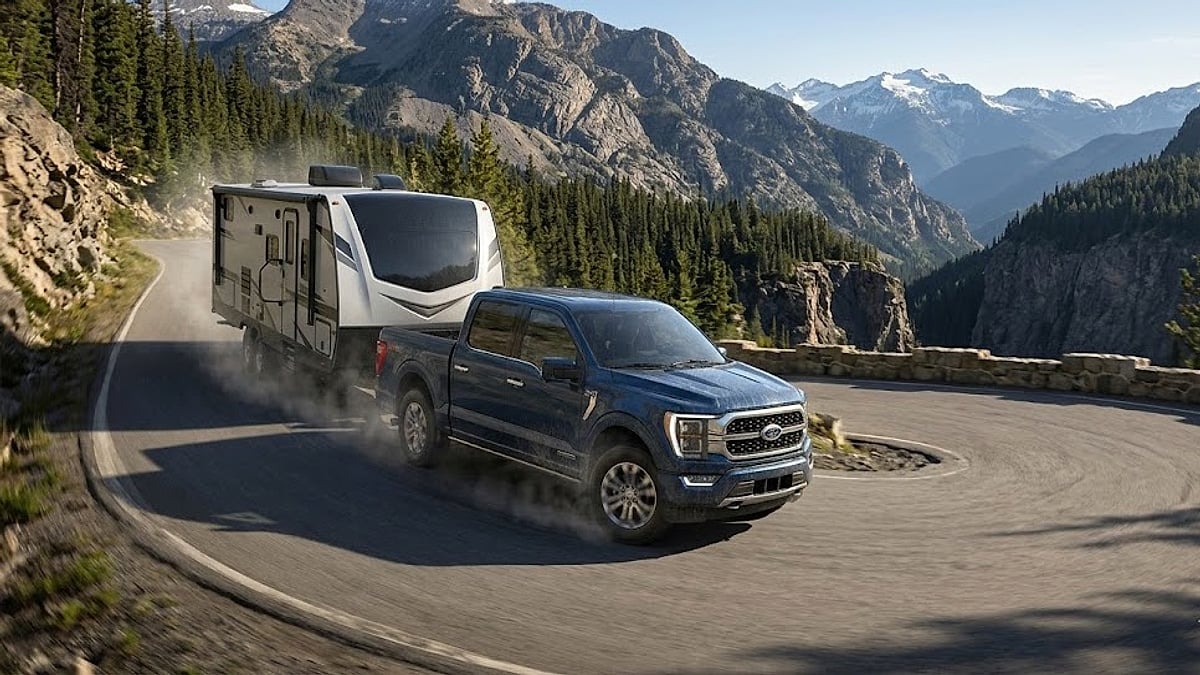 A 2024 F-150 PowerBoost safely navigates a steep mountain grade despite a sudden startup voltage drop disabling its trailer brakes