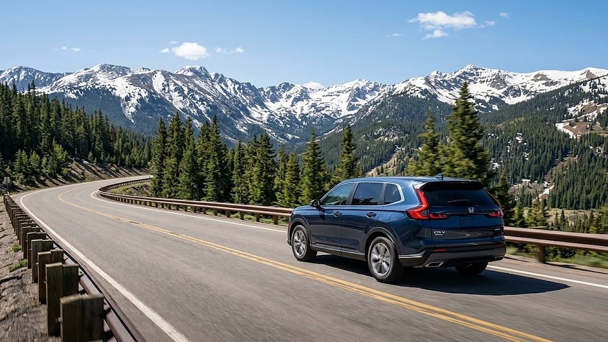 A 2026 Honda CR-V Hybrid navigates a high-altitude Colorado mountain highway, demonstrating vehicle performance under intense real-world driving conditions