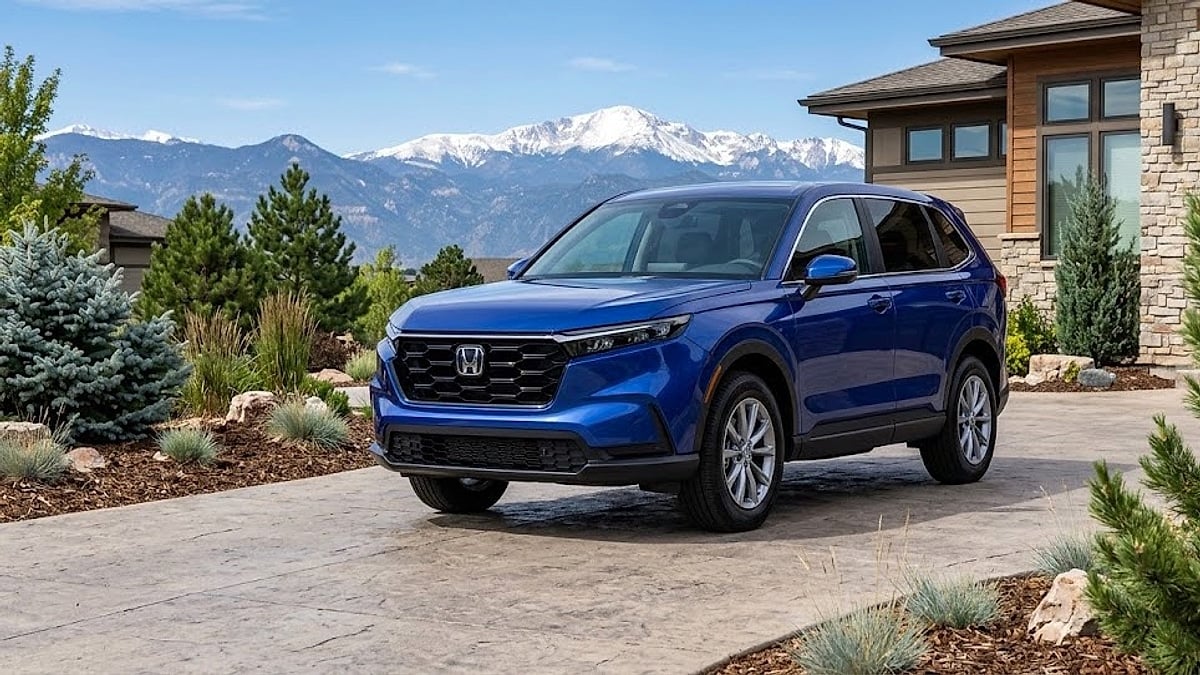 A 2026 Honda CR-V Hybrid parked in a suburban Colorado driveway, ready for mountain adventures and high-altitude driving