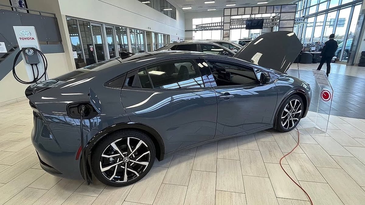 A 2026 Toyota Prius XSE Premium PHEV in Guardian Grey in the the dealer's showroom