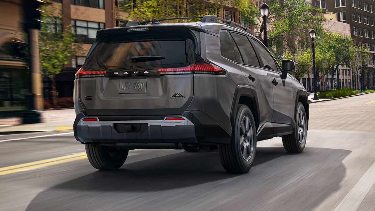 A 2026 Toyota RAV4 Hybrid driving on a street in Iowa
