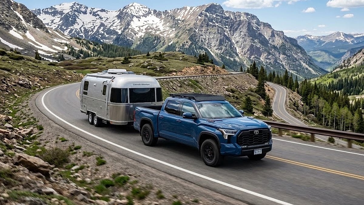 A 2026 Toyota Tundra hauls a travel trailer over a steep Colorado mountain pass, stressing its twin-turbo V6 engine internals-optimized (1)