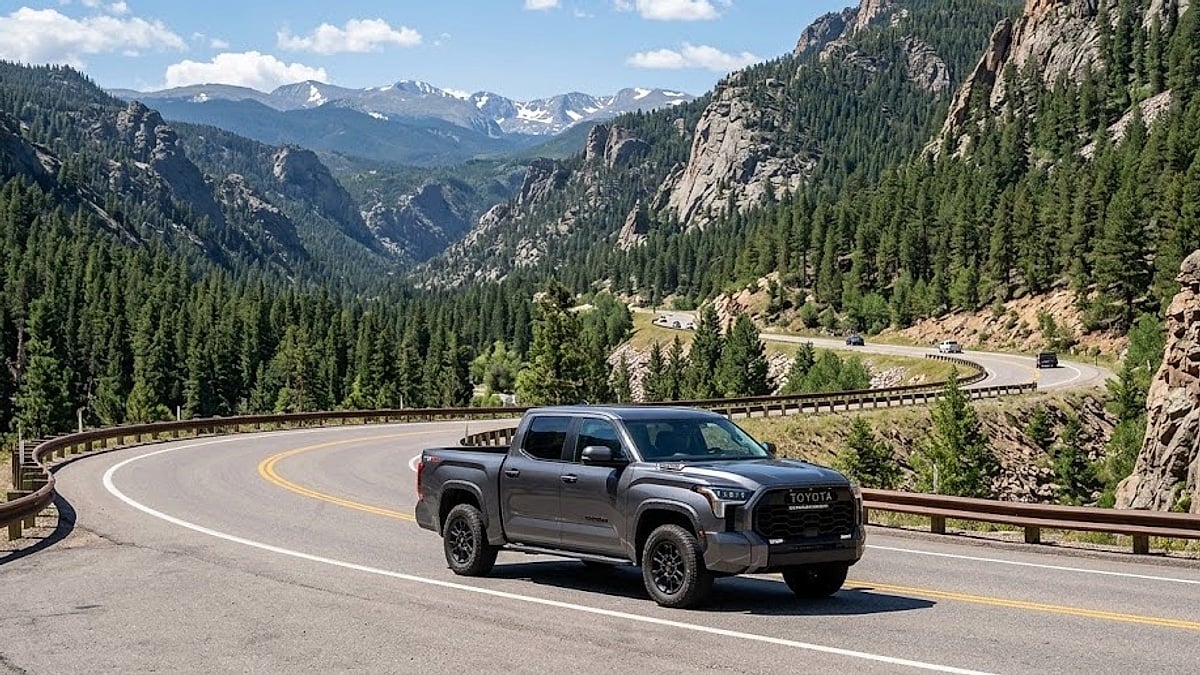A 2026 Toyota Tundra navigates the winding slopes of Mount Vernon Canyon, Colorado, showcasing its power amidst rocky terrain