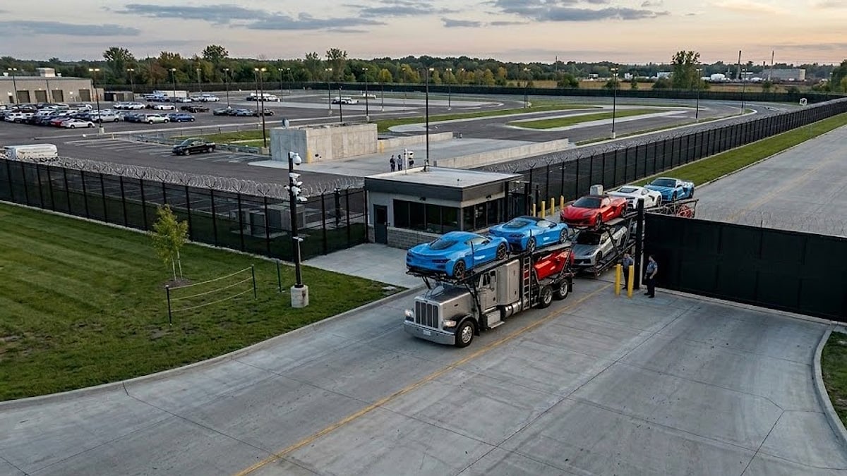 A car hauler loaded with new 2026 C8 Corvettes enters a secured Michigan holding facility for specialized factory recall remediation