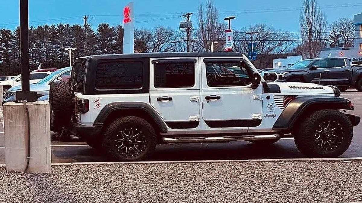 A Jeep Wrangler in the Toyota dealer's lot after a trade in for a 2026 Tacoma