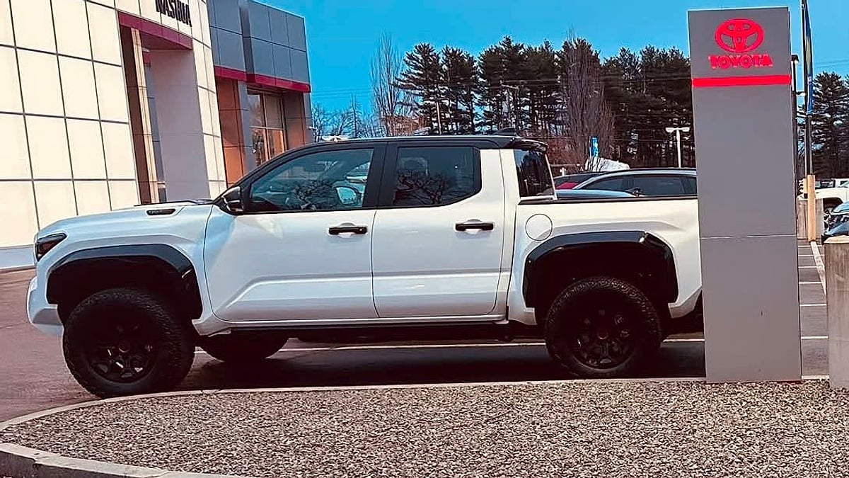 A new 2026 Toyota Tacoma parked in the Toyota dealer's lot ready for delivery