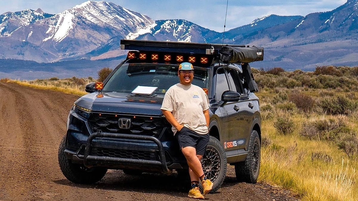 Aaron Chokbengboun with his 2026 Honda CR-V on a high mountain road in Colorado