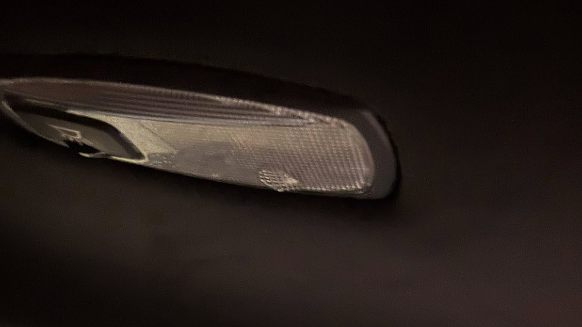 Close-up of Ashley's Kia Telluride interior roof light showing visible moisture and water intrusion damage.