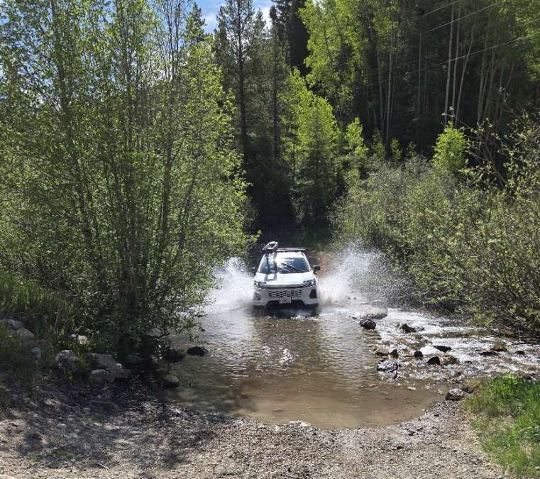 Toyota RAV4 LE on BFGoodrich Trail-Terrain+ tires fords a small water section