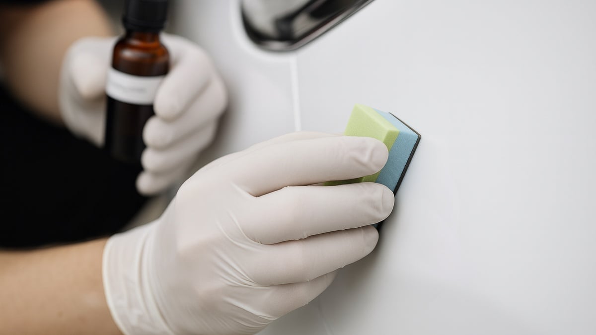 Car getting ceramic coating applied onto its paint