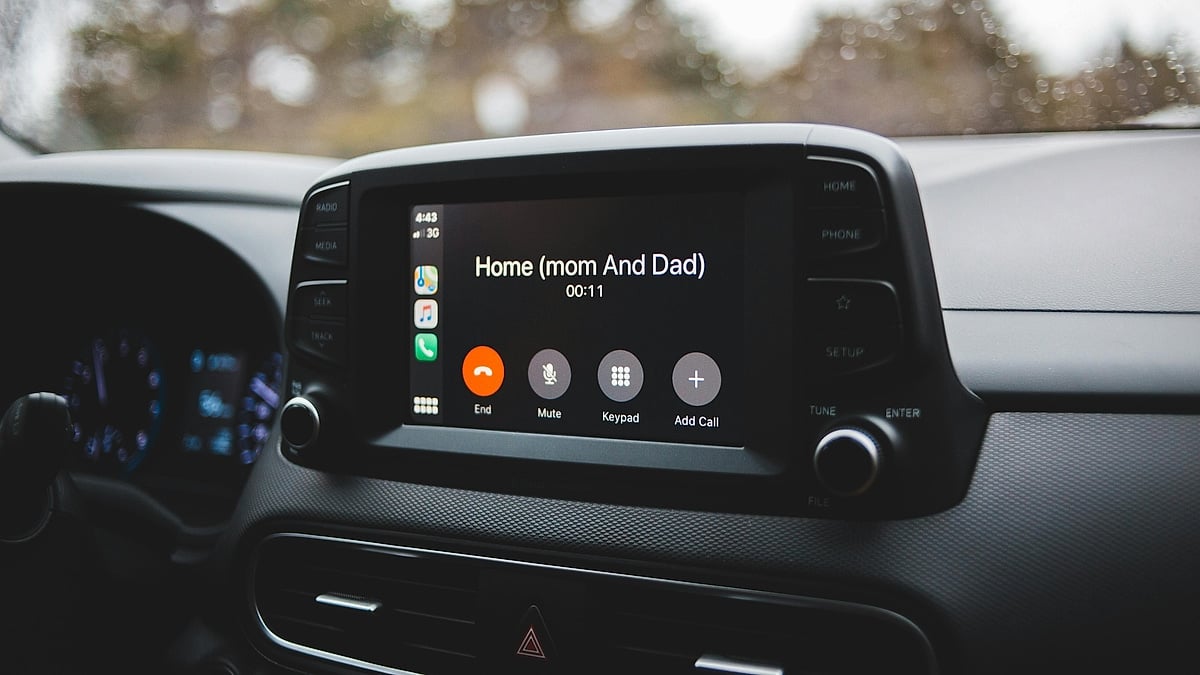 Car infotainment screen showing an active phone call from the dashboard view.