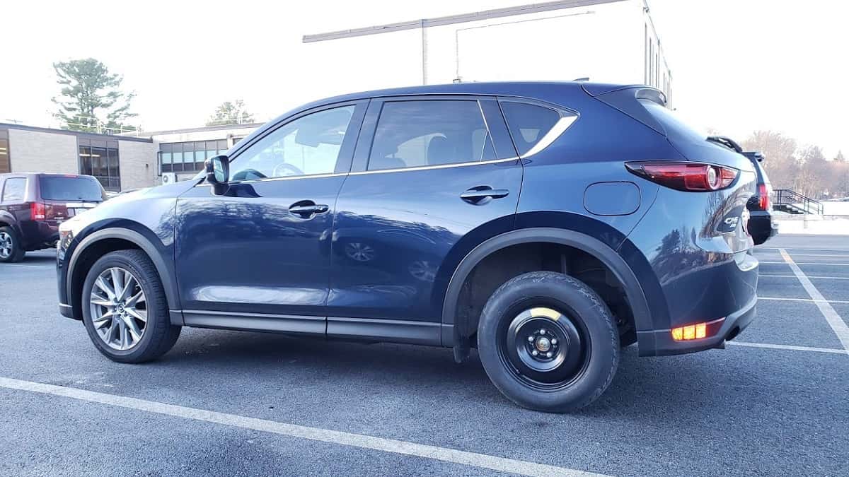 A Mazda CX-5 with its spare tire mounted is shown
