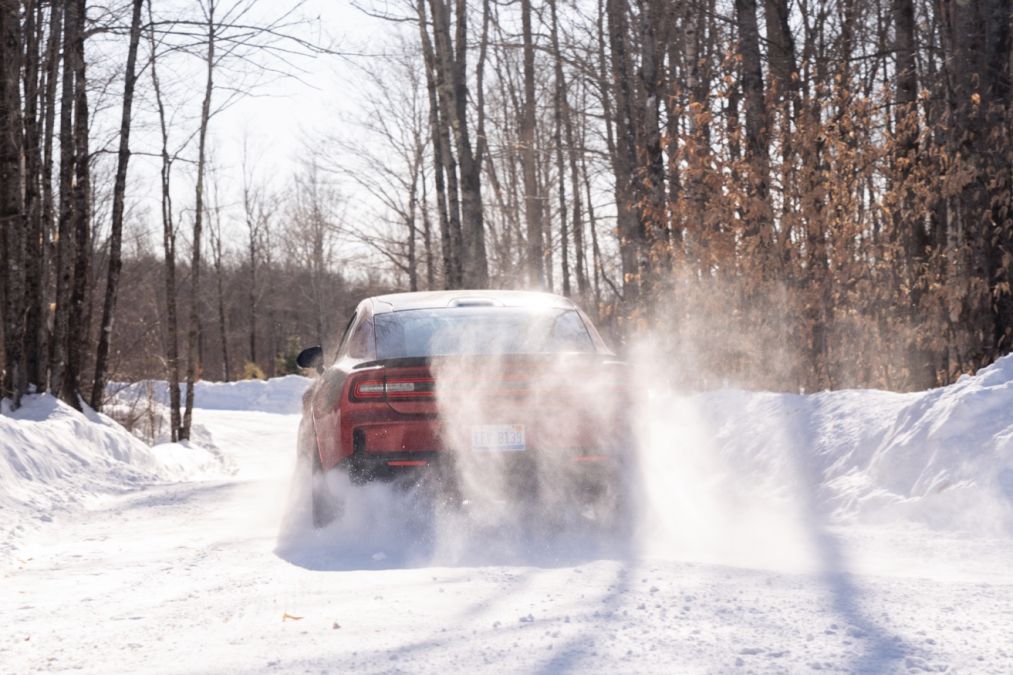 A Dodge Charger rallies in the snow