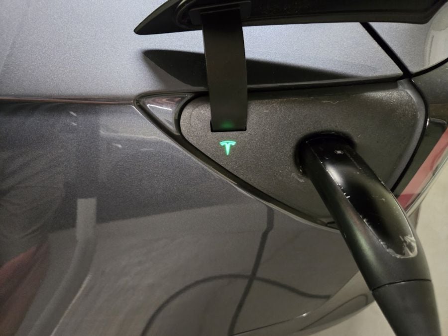 Emporia NACS charger handle in a Tesla Model 3