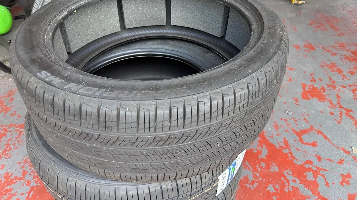 EV tire at a tire shop showing foam noise-reduction inserts attached inside the tire.