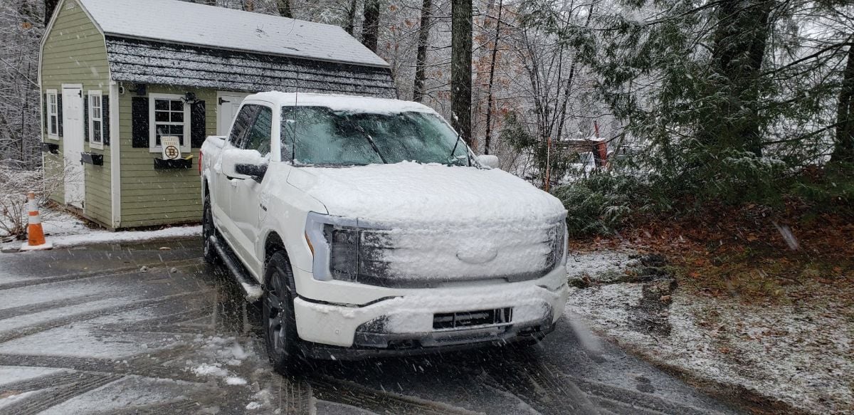A Ford F-150 Lightning in snow