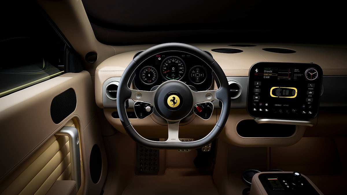 Ferrari Luce interior with tan dashboard, steering wheel and digital driver displays.