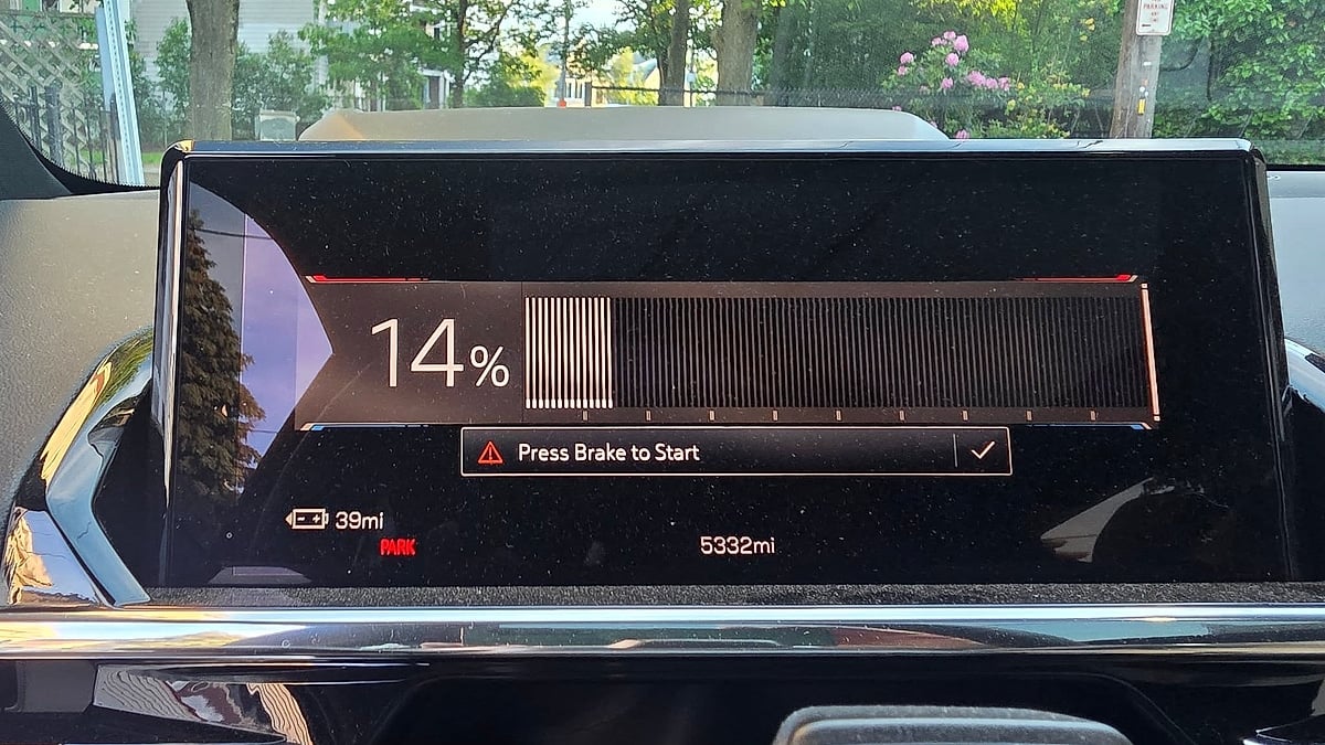 GMC Sierra EV dashboard display showing 14 percent battery charge and 39 miles of estimated range.