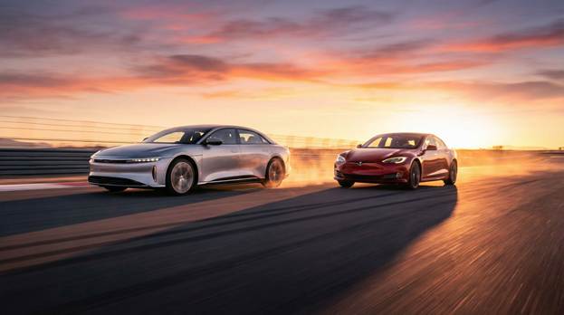 A group of cars driving on a road</p>
<p>AI-generated content may be incorrect.