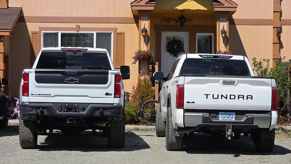 Isaac Dirol's Toyota Tundra and 2025 Chevrolet HD ZR2 Bison 6.6L parked near his home in Alaska