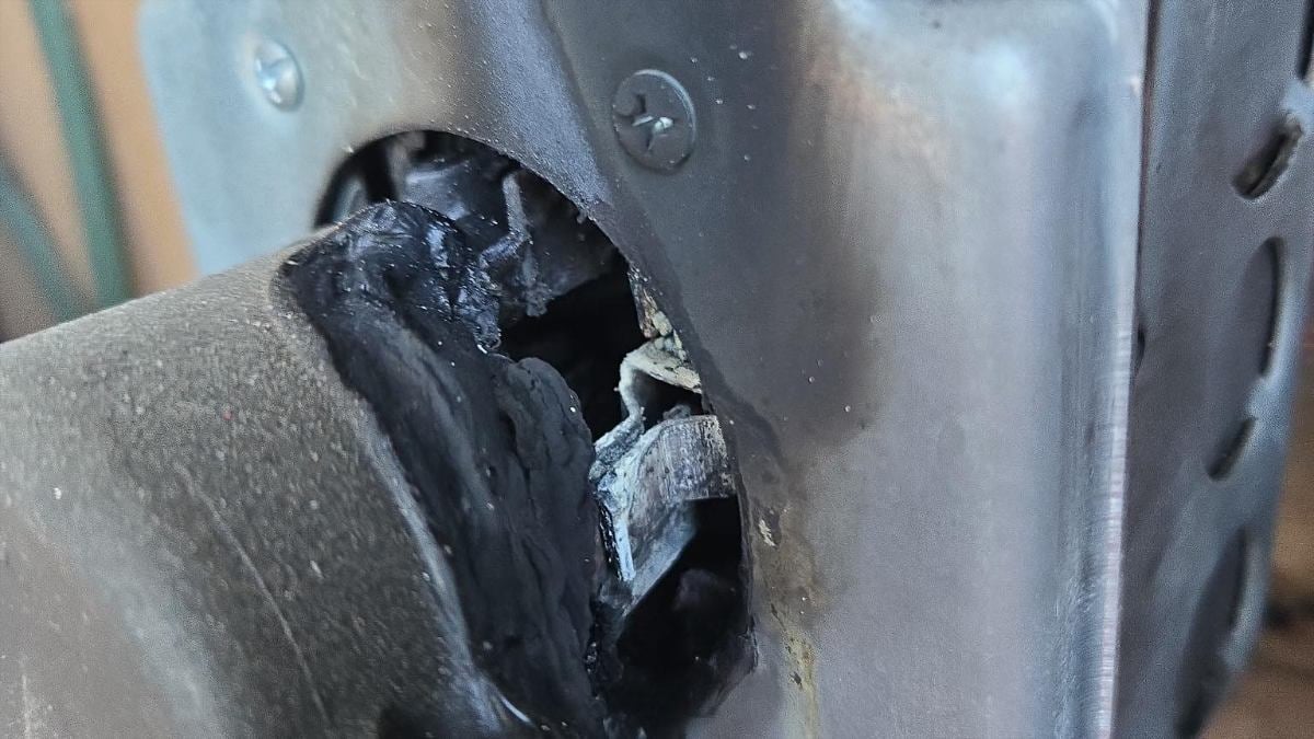 A melted EV charger outlet connector