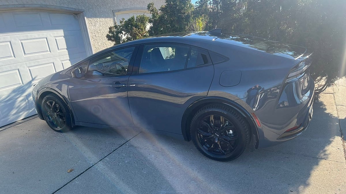 Kelly Kach's 2026 Toyota Prius XSE Premium PHEV in Guardian Grey in his driveway