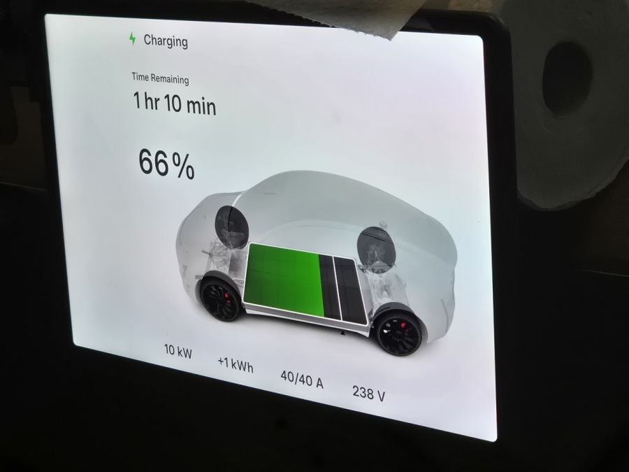 Tesla Model Y screen shows charging status