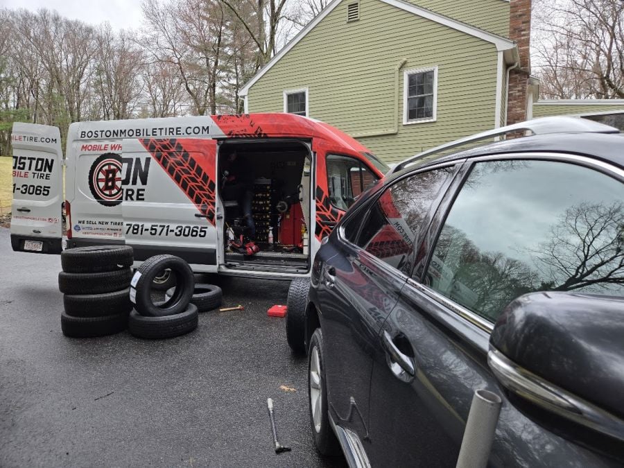 Goodyear Assurance MaxLife2 Tire being mounted and balanced by Boston Mobile Tire