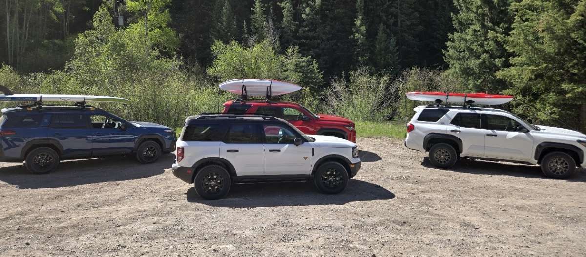 A group of SUVs all with BFGoodrich tires is shown in an rural setting. 