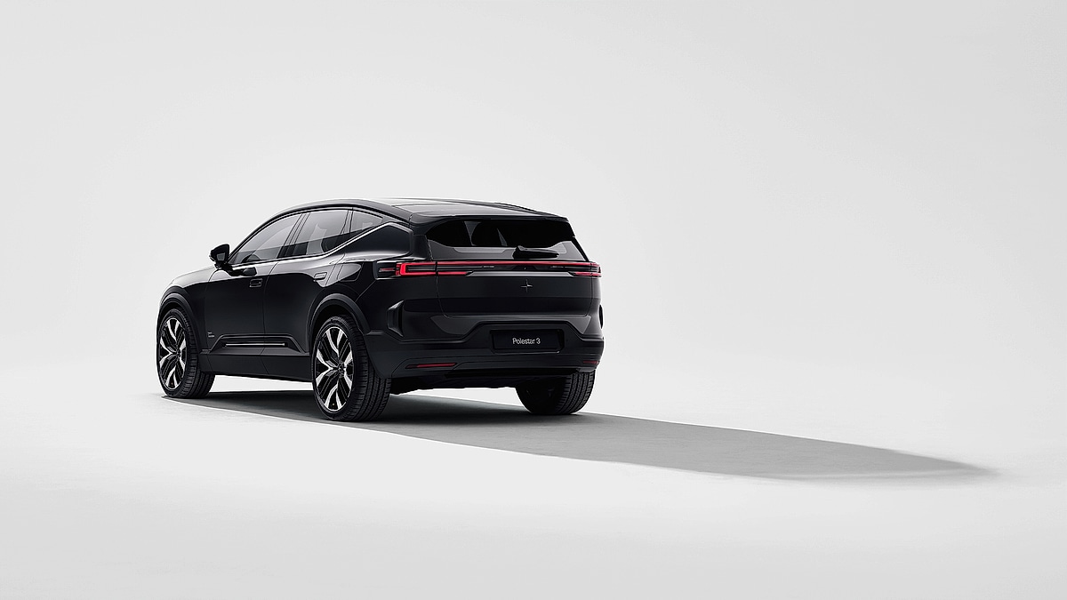 2025 Polestar 3 electric SUV in gloss black finish photographed from the rear three-quarter angle against a white studio background