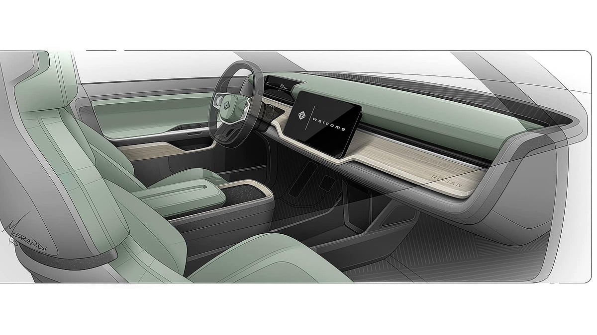Rivian R2 interior concept sketch showing sage green cabin with Rivian welcome screen on wide horizontal infotainment display