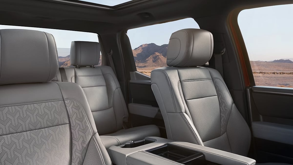 Premium interior view of a 2026 Toyota Tundra featuring leather seats, panoramic sunroof, and spacious cabin design.