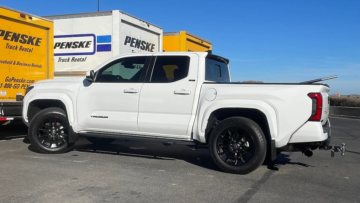 Side view of Ryan Johnson's 2025 Toyota Tacoma SRD AWD parked at a Prescott, Arizona job site