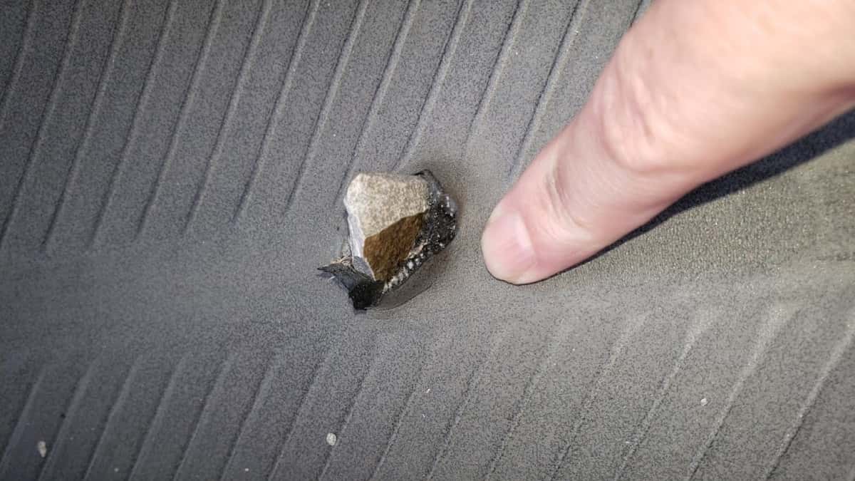 A tire with a stone through it