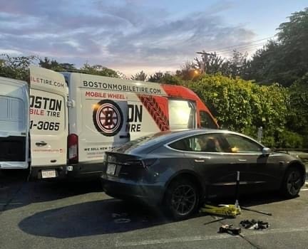 Image of Tesla getting new tires courtesy of Jay Condrick of Boston Mobile Tire