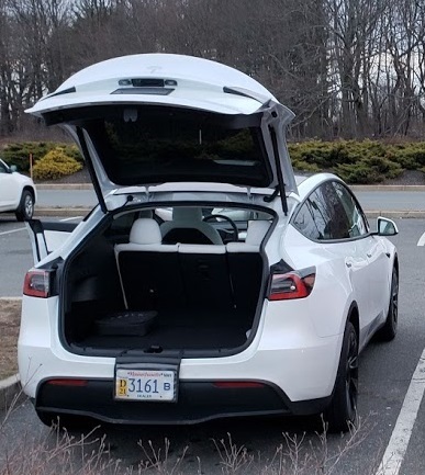 A new tesla wears a Dealer plate in Mass.