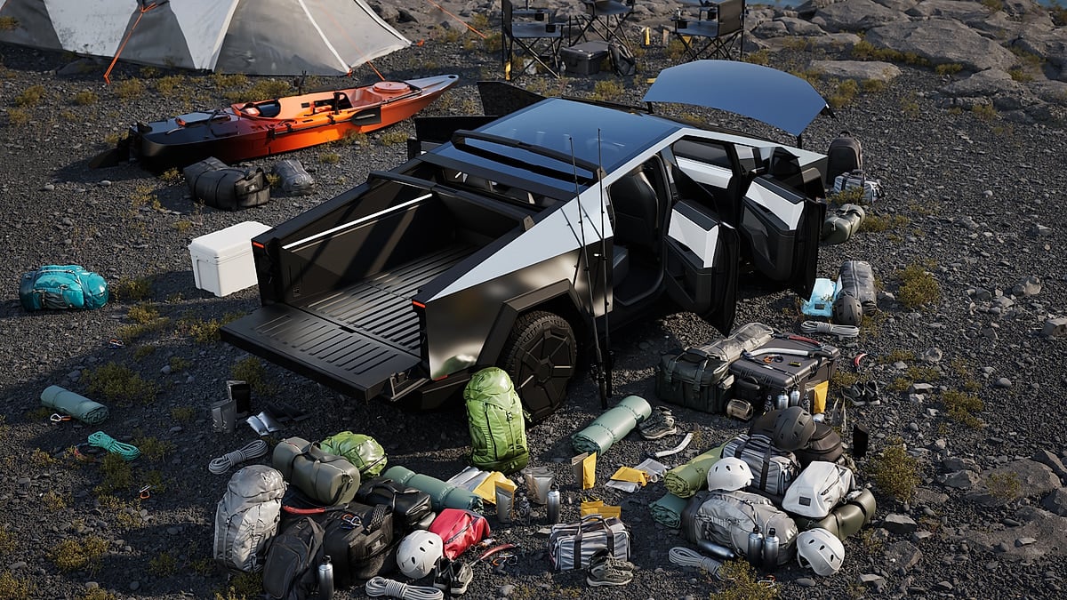 Tesla Cybertruck with doors and tailgate open surrounded by camping gear, bags, helmets, and a kayak.