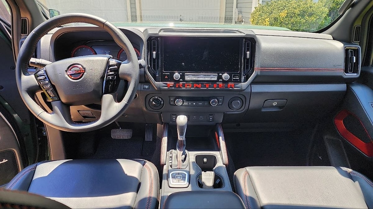 The 2026 Nissan Frontier's interior as the 12.3 inch NissanConnect touchscreen anchors the dashboard