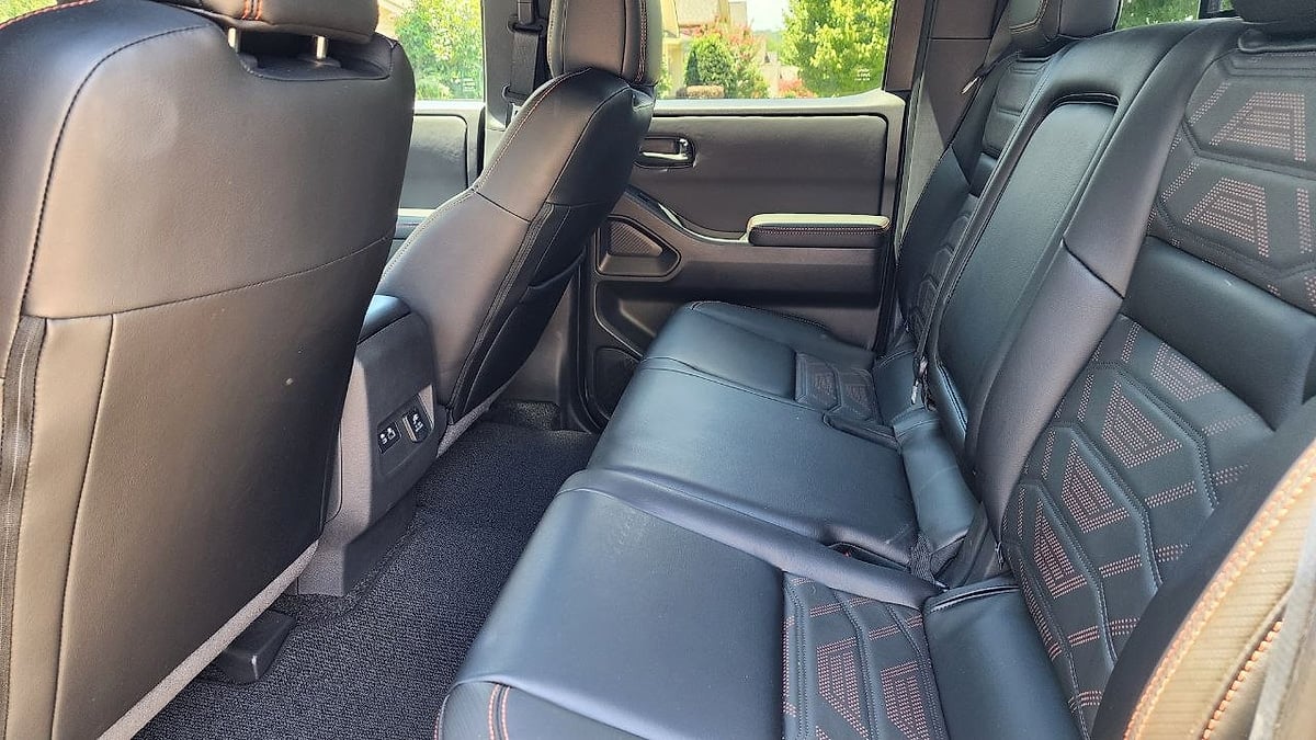 The 2026 Nissan Frontier Crew Cab's second row is where the SWB Frontier earns its keep as a family and work truck at once 