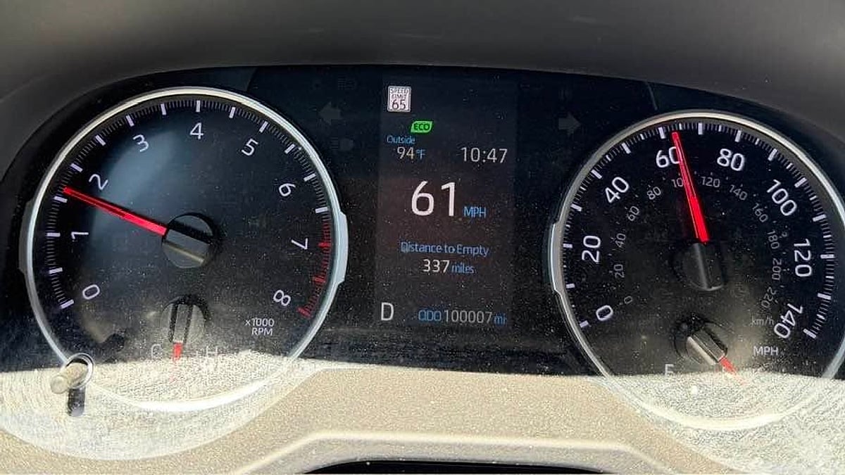 The dashboard of a 2024 Toyota RAV4 showing the 100,000 mile mark