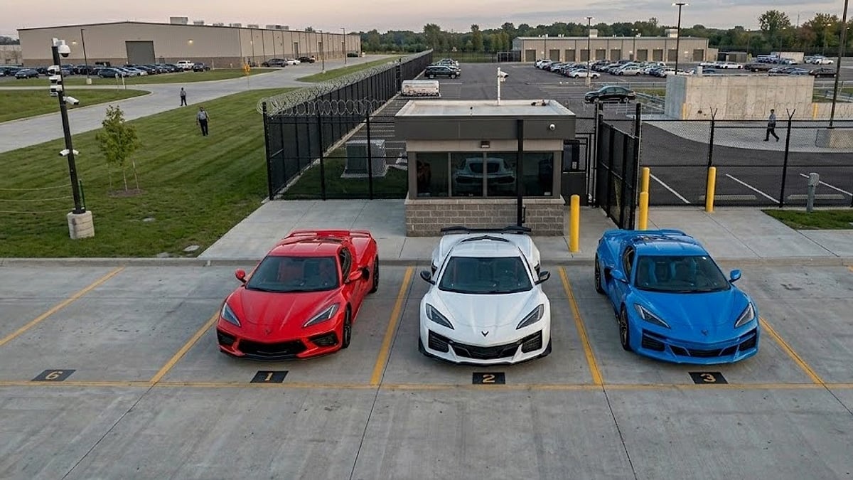 Three new 2026 C8 Corvette variants sit parked side-by-side inside a secure Michigan validation lot awaiting factory recall remediation